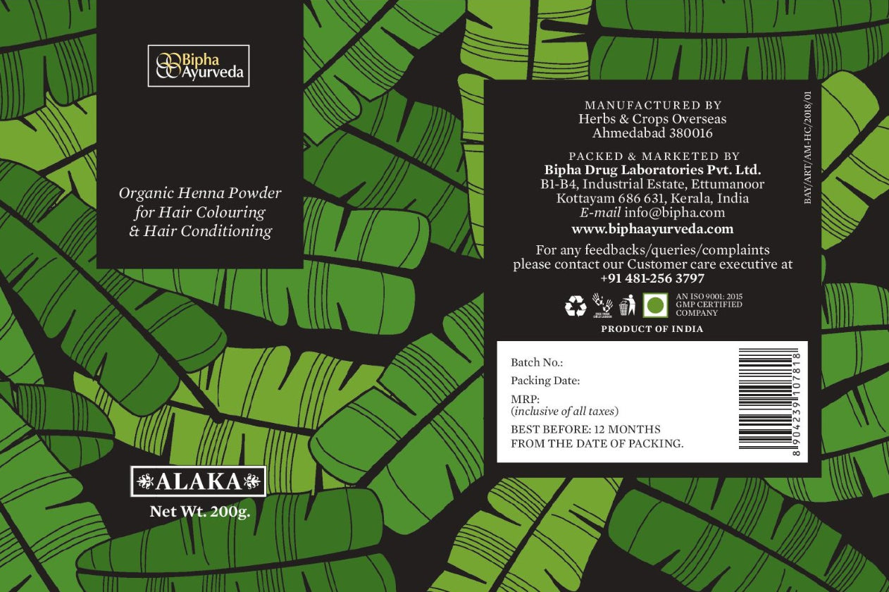 Organic henna powder tin label close-up on green leaf patterned packaging