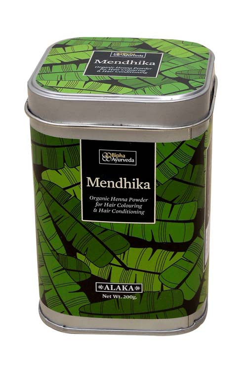 Organic henna powder tin with green leaf pattern and brand label on front