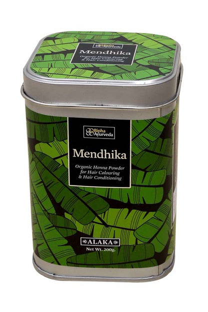 Organic henna powder tin with green leaf pattern and brand label on front
