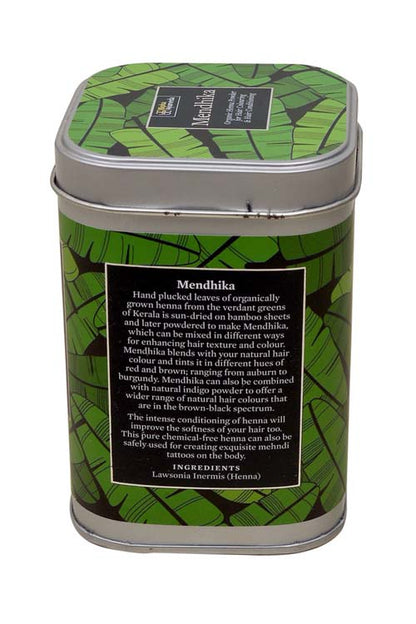 Organic henna powder tin with green leaf pattern and text label on back