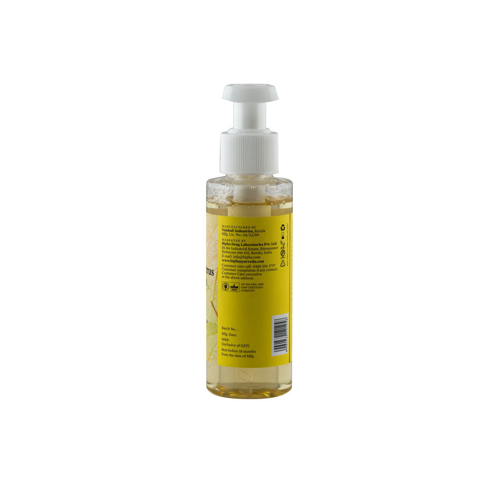 Hand wash bottle with pump, back label on clear bottle filled with yellow liquid