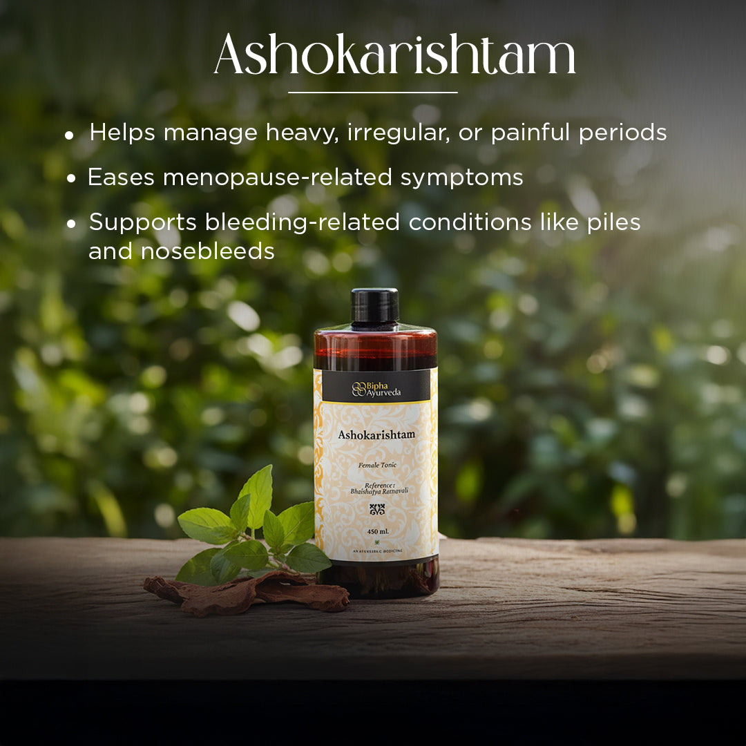 Ashokarishtam 450 ml tonic bottle with black cap on wooden surface with green leaves