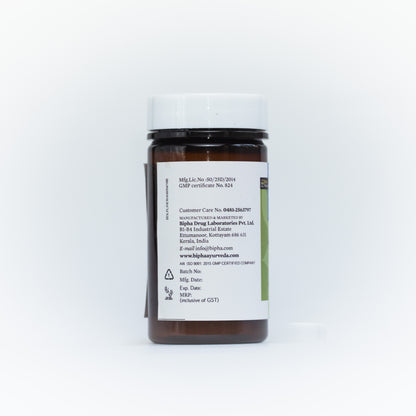 Spirulina supplement bottle with ingredient information panel on back, black cap.