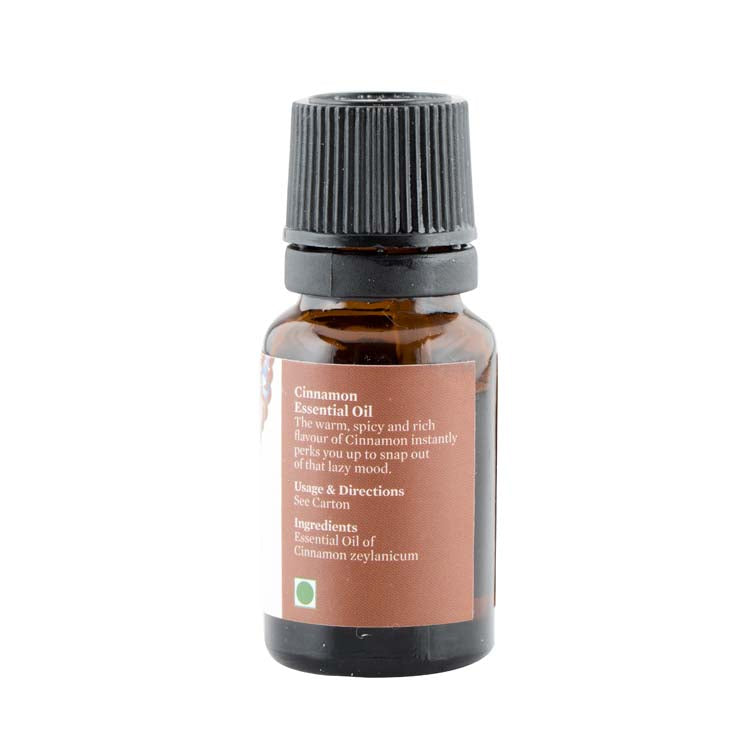Amber essential oil bottle with ribbed black cap and back label
