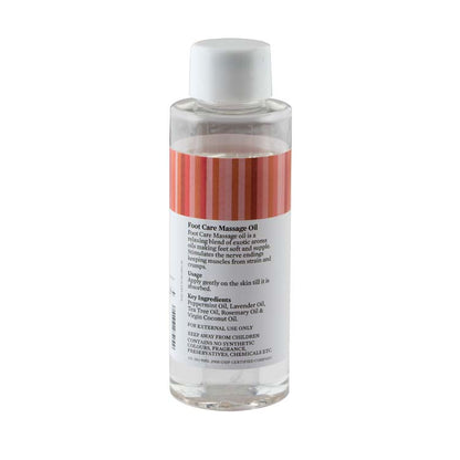 Massage oil bottle with clear body, white cap, and back label