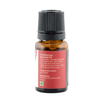 Frankincense essential oil bottle with amber liquid and ingredient panel label