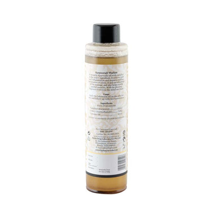 Ayurvedic oil bottle showing the back label text, with black cap included.