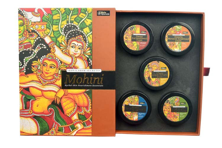 Face cream gift pack with orange box open tray of five round cream containers