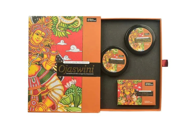 Sandalwood skin longevity essentials set with open box showing two round jars and herbal bar