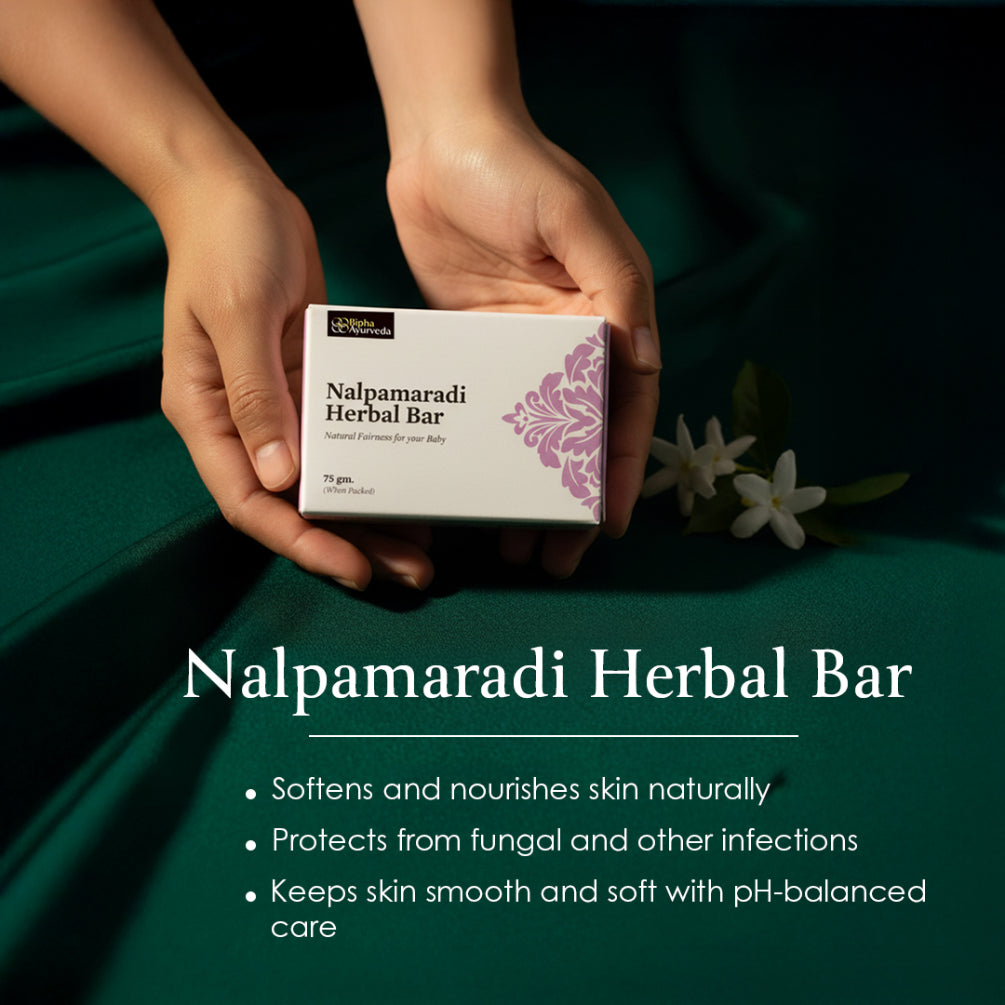 Hands holding Nalpamaradi Herbal Bar box, purple floral logo, 75 g pack.