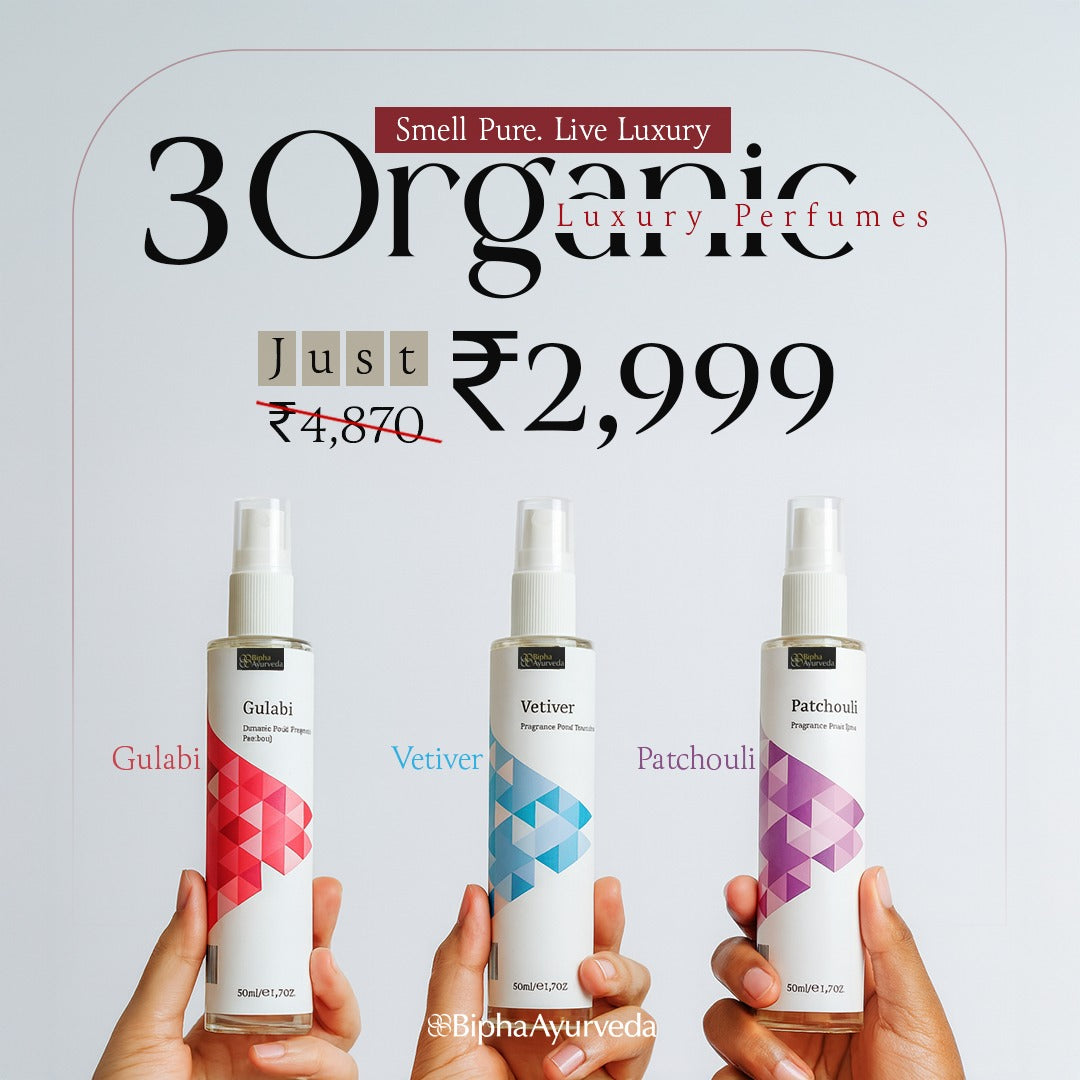 Three spray perfume bottles held by hands with patterned labels and beige caps