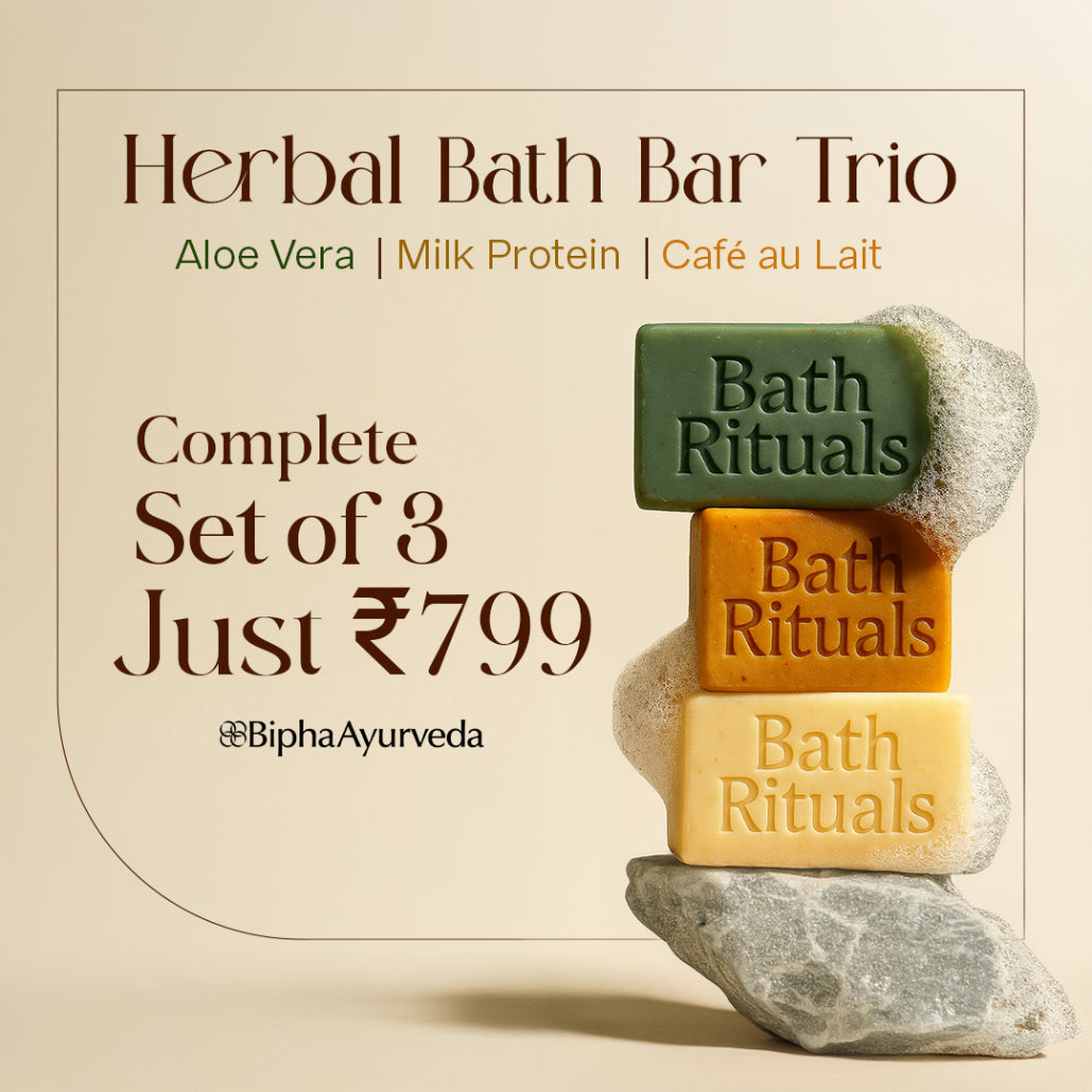 Herbal bath bar trio: three stacked soap bars in green, orange, and yellow.