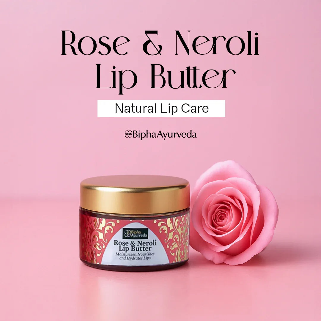 Lip butter jar with gold lid and pink rose beside it.