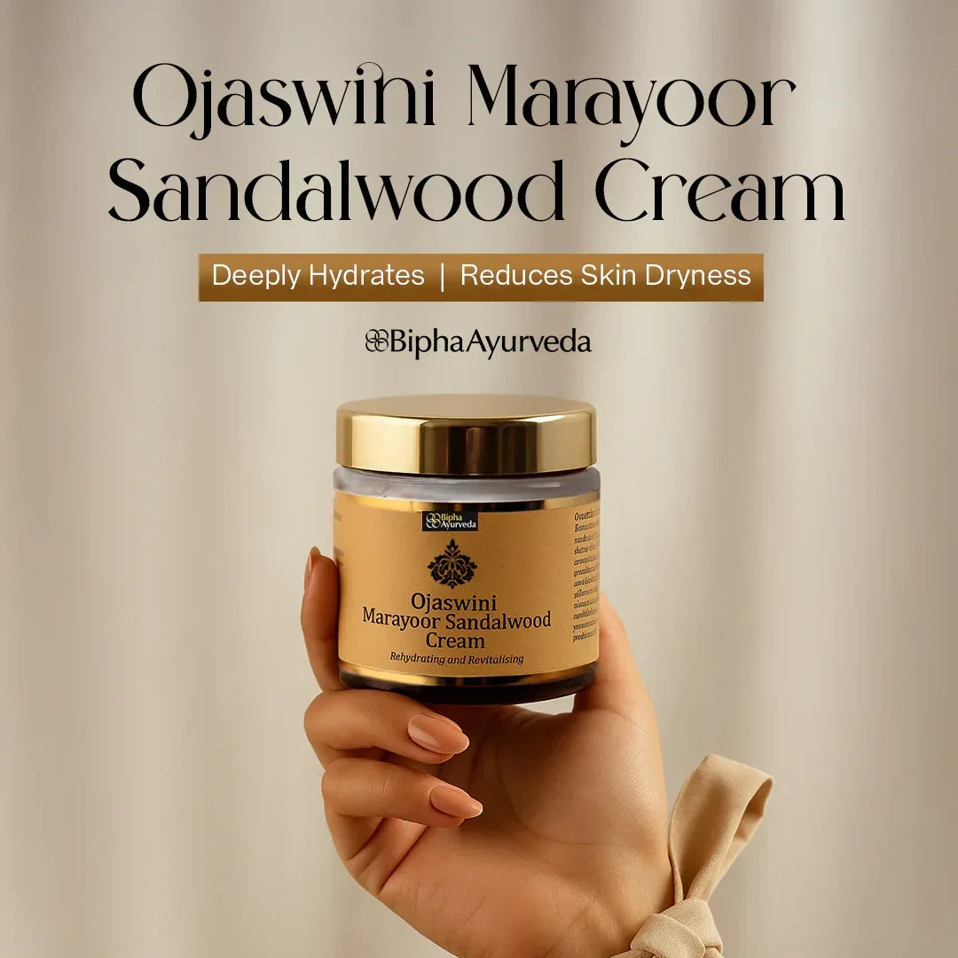 Sandalwood face cream jar with gold lid held in hand, front label visible