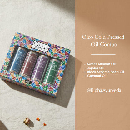 Cold-pressed oil combo box with four small bottles in labeled oils