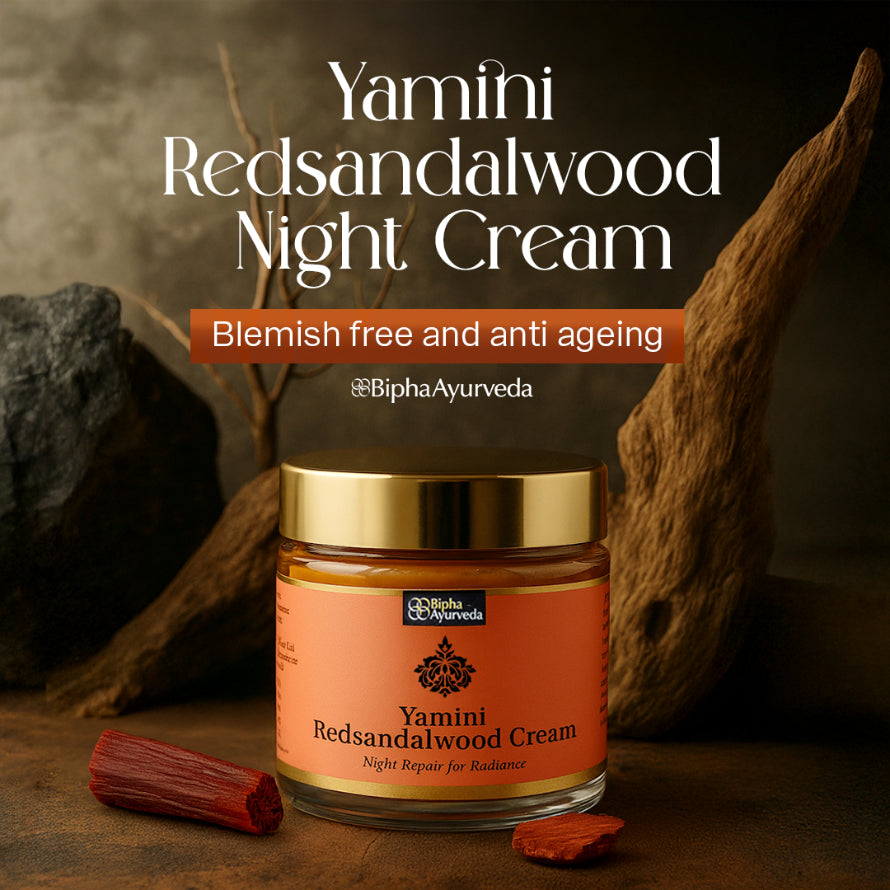 Red sandalwood night cream jar on dark surface with sandalwood pieces